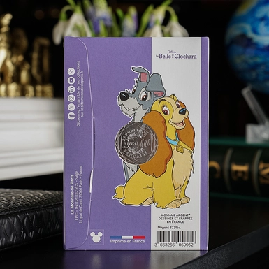 wow video Колекційна срібна монета Disney Classic "Леді та Бродяга", 10 євро, 2025 рік