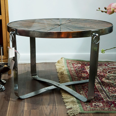 Round table on four metal legs with rivets - buy in an online gift store 
