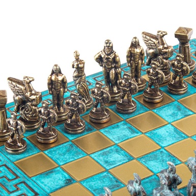 chess with golden figures of the ancient gods